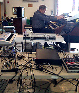 jim Gregory surrounded by electronic gear and keyboards